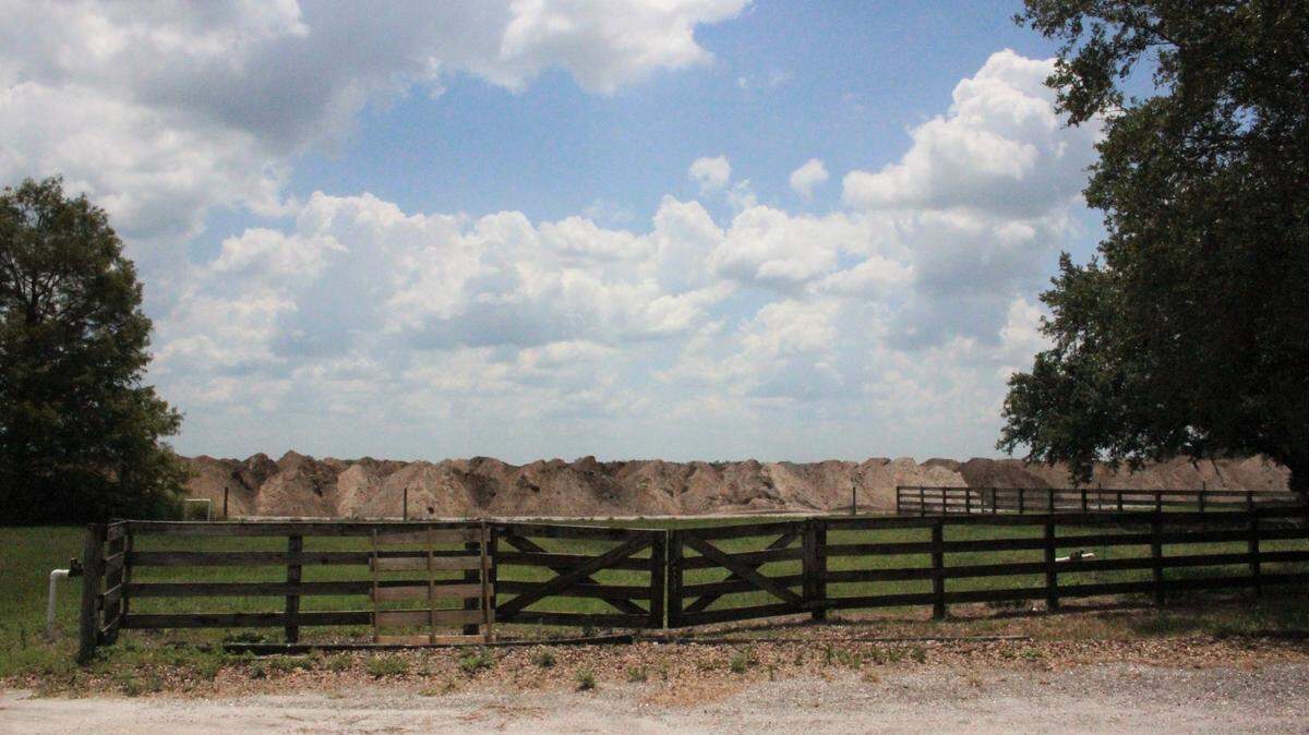 Earth is heaped behind the fence on the SMR Farms building, part of Lakewood Ranch’s Northeast Quadrant where the next wave of development is coming.