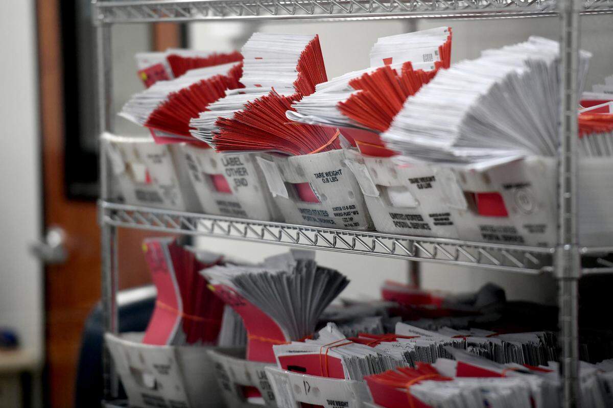 Mail in ballots wait for sorting at the Supervisor of Elections Office on Nov. 8, 2022.