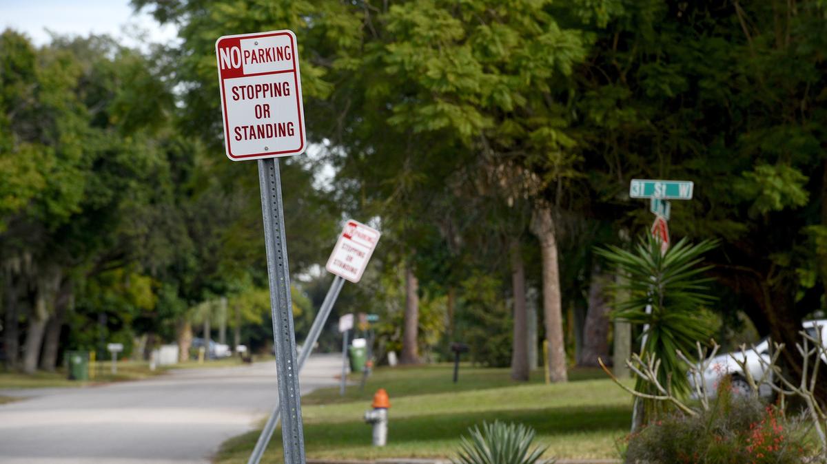 The Manatee County Board of Commissioners voted 6-1 to approve a new ordinance that blocks drivers from parking on the right-of-way near schools between 6 a.m. and 5 p.m. on school days. Signs show no parking on the street just south of Manatee High.