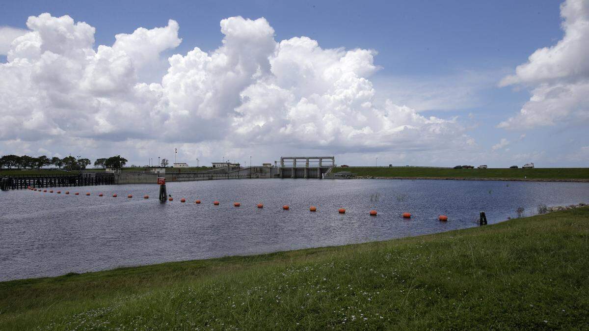 A lock and dam to control water from Lake Okeechobee. Southwest Florida recreational and tourism business are crying foul because of runoff from the big lake is causing a smelly mess that threaten estuaries needed for sport fish species. ASSOCIATED PRESS FILE