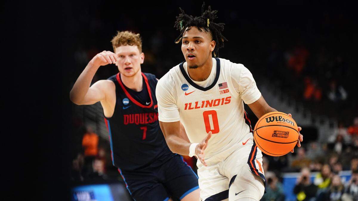 Mar 23, 2024; Omaha, NE, USA; Illinois Fighting Illini guard Terrence Shannon Jr. (0) dribbles the ball against Duquesne Dukes forward Jake Necas (7) during the second half in the second round of the 2024 NCAA Tournament at CHI Health Center Omaha. Mandatory Credit: Dylan Widger-USA TODAY Sports