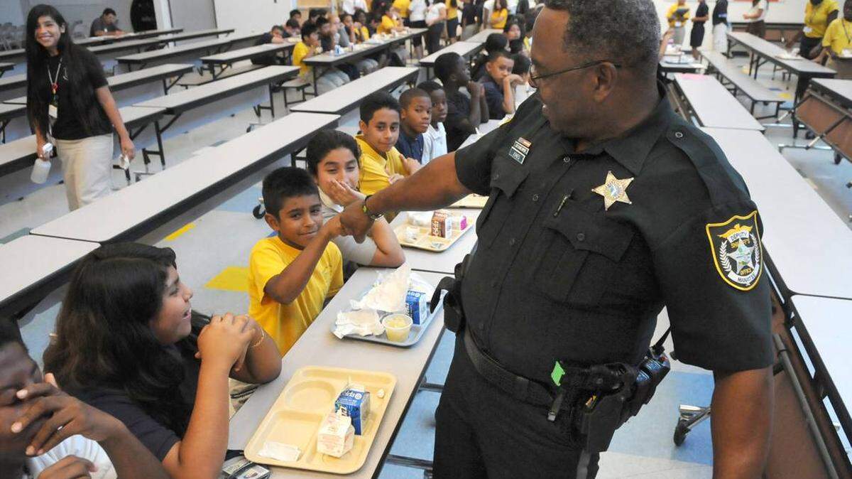 School Resource Officer Deputy Johnny Jones interacts with students at Daughtrey Elementary School in October 2015.
