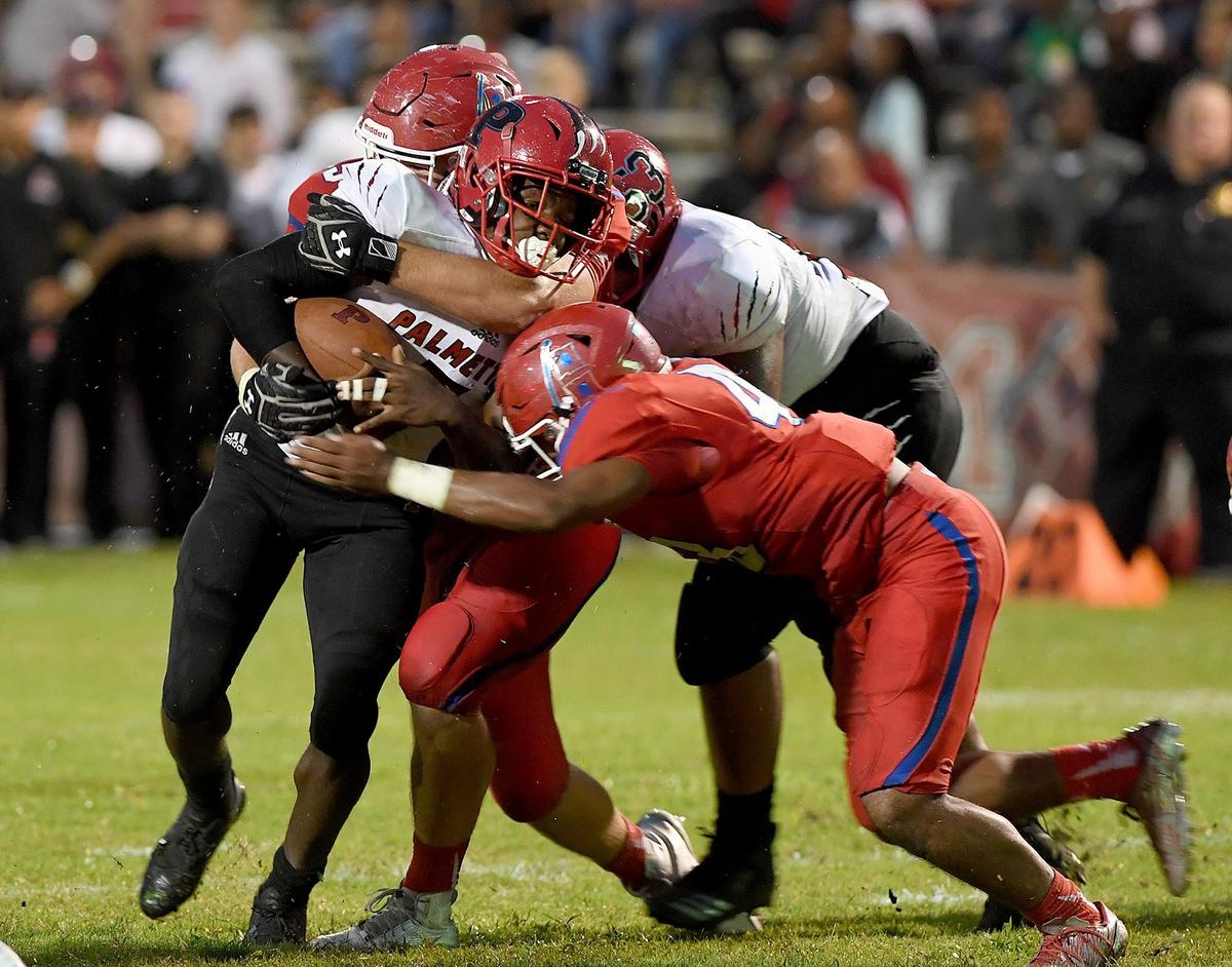 Palmetto’s Eddravian Butler is slowed by the Manatee defense.  Both teams are 1-1 heading into Week 3.