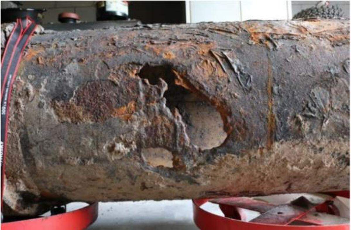 Researchers who estimated the amount of sewage spilled from a Longboat Key sewage line said these holes were partially blocked by a tree root, which led them to reduce an estimated spill to 11 million gallons.