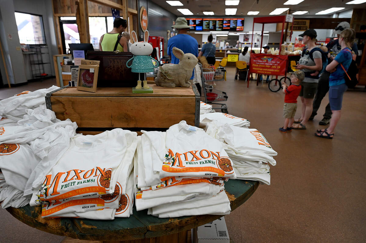 Customers wait at the checkout at Mixon Fruit Farms on May 25, 2023.