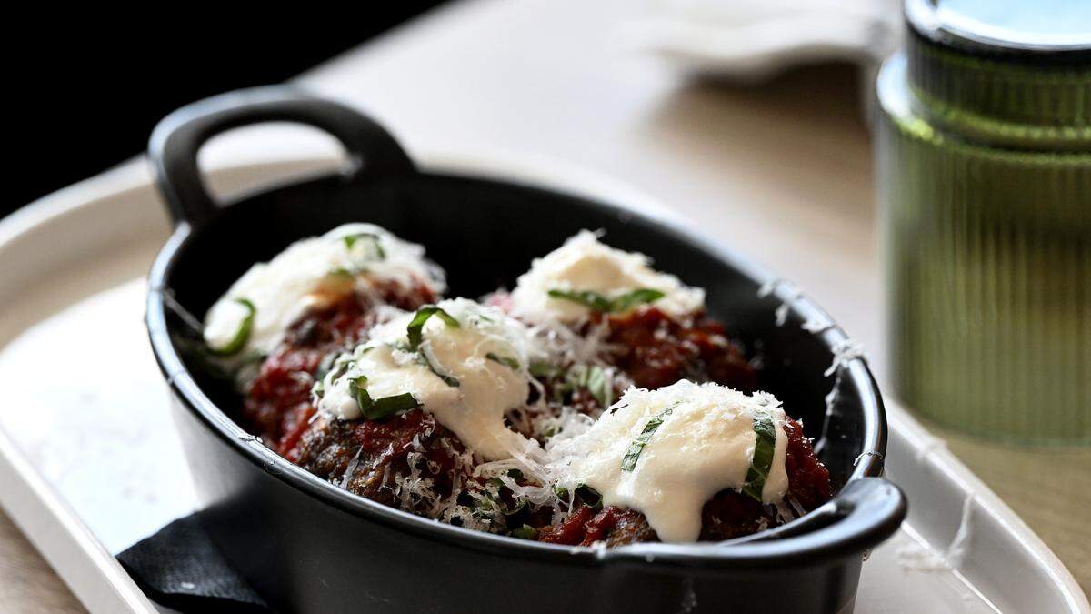 The wood-fired Wagyu meatballs with roasted tomatoes, house ricotta, fresh basil and pecorino at iDalia in Parrish on May 19, 2026.