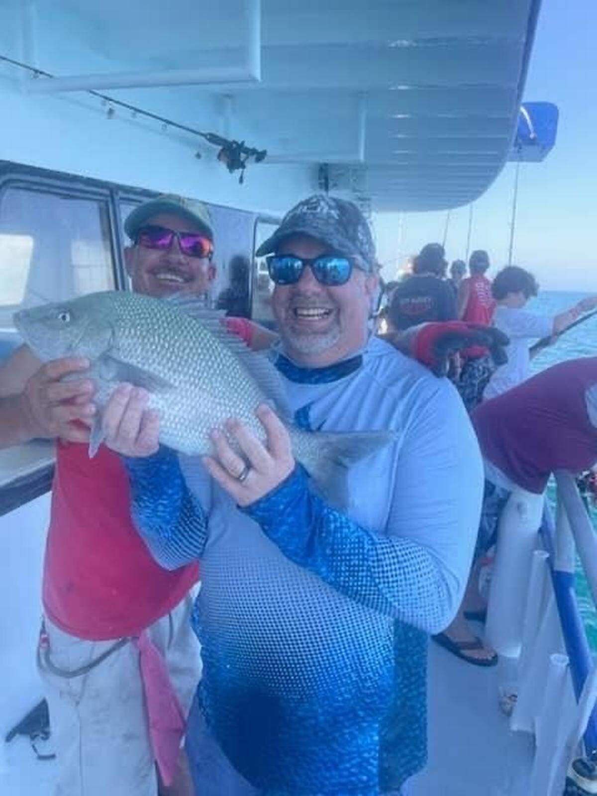 Jamie Andrews poses with a grunt he caught on a recent fishing trip with his daughter that is just shy of a world record.