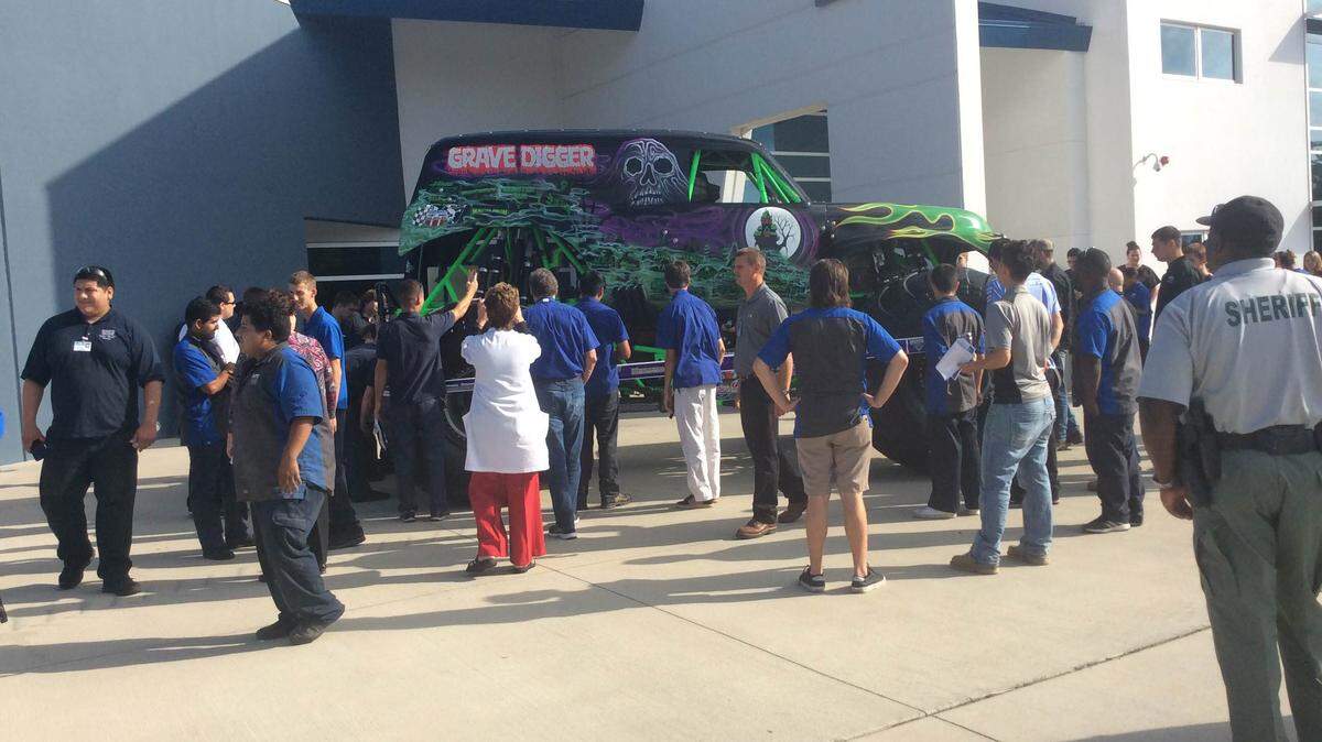 Manatee Technical College students look at a monster truck brought to campus by Feld Entertainment as part of National Manufacturing Day on Oct 2. MEGHIN DELANEY / Bradenton Herald