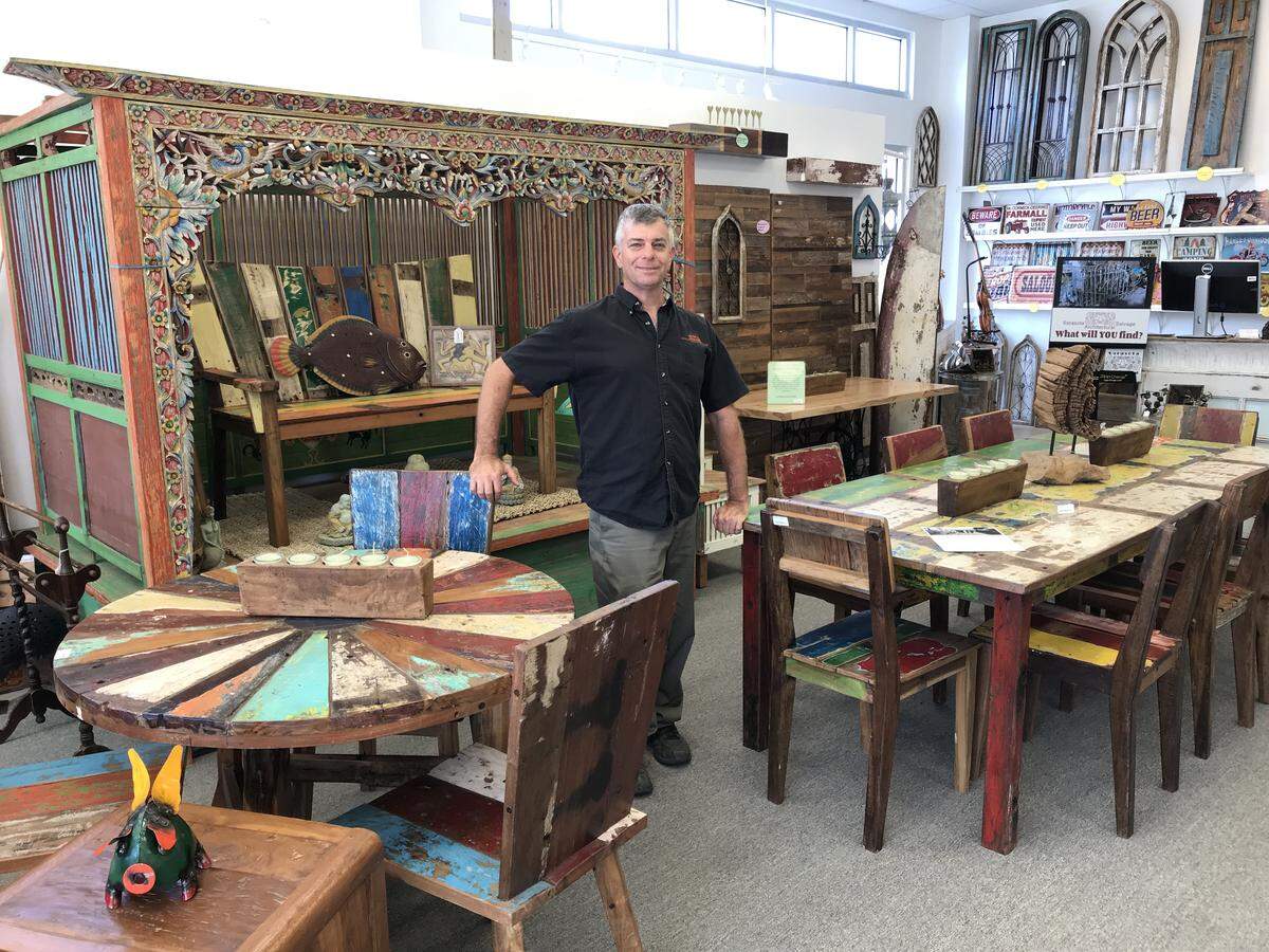 Jesse White, founder of Sarasota Architectural Salvage, stands with some of the merchandise in his new retail store in Manatee County at 5265 University Parkway, unit 105.