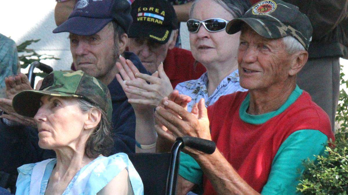 Chuck Fischer, 76, a Marine veteran, applauds the Manatee River Assisted Living Veterans Day program on Wednesday. He attended with his wife Pat . 
 JAMES A. JONES JR./Bradenton Herald