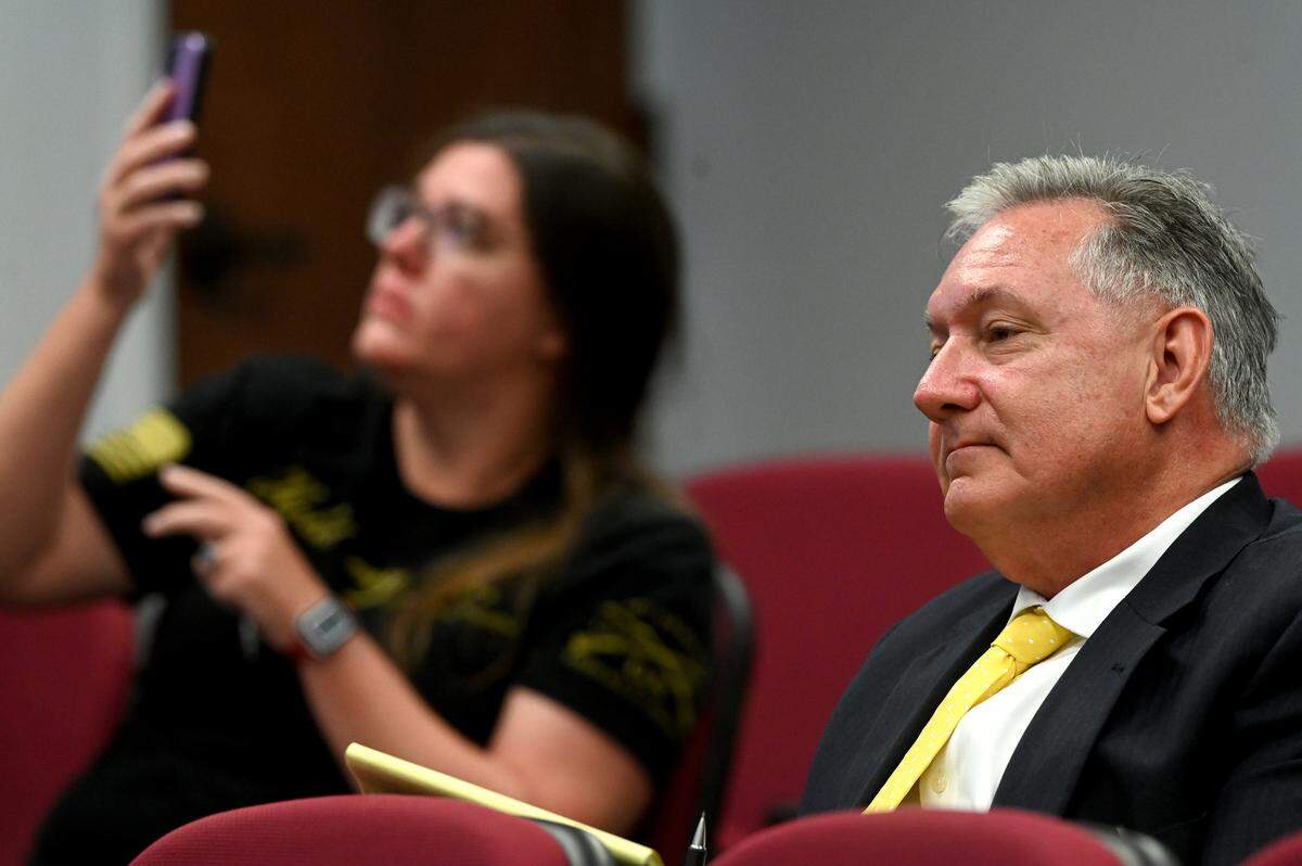 Jon Mast, CEO and chief lobbyist of the Manatee-Sarasota Building Industry Alliance, listens from the audience during the Manatee Board of Commissioners meeting on April 25, 2023.