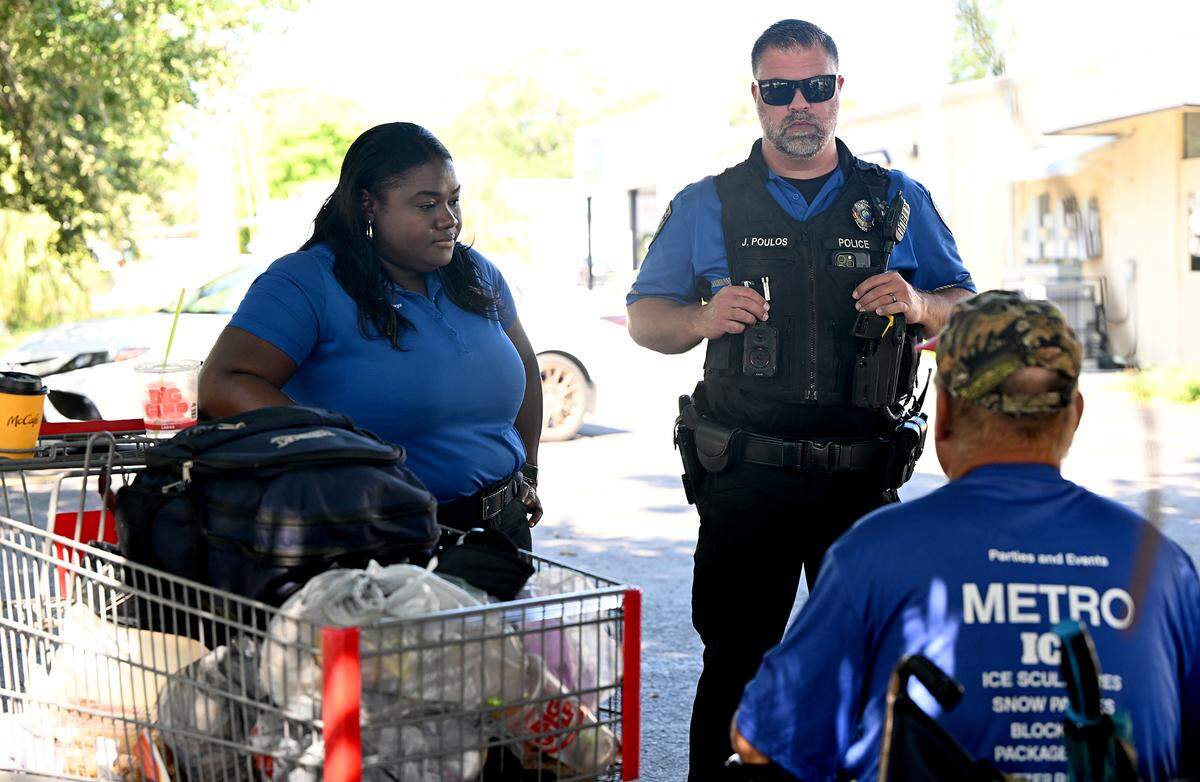 Bradenton Police officer Jordan Poulos works with Manatee County EMS case worker Tameka Foster Wilson as part of a homeless outreach team to build relationships with locally unhoused people and connect them with services and resources.