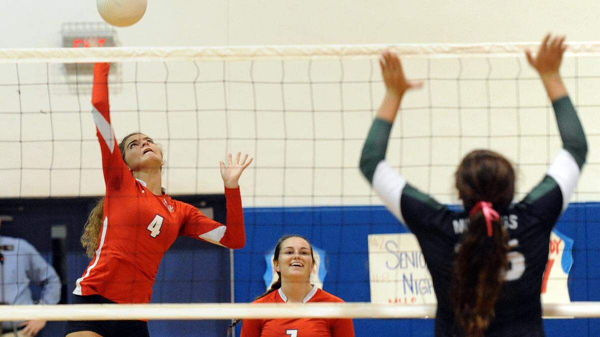 Manatee's Grayson Hall hits the ball with Gillian Cassidy against Lakewood Ranch's Kahlee York Thursday night at Manatee. 
 TIFFANY TOMPKINS-CONDIE/Bradenton Herald