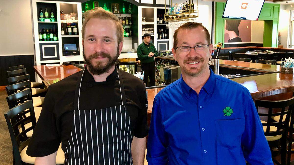 Chef Issac Johnson, left, and partner Bruce Mahnke at McGrath’s in 2021.