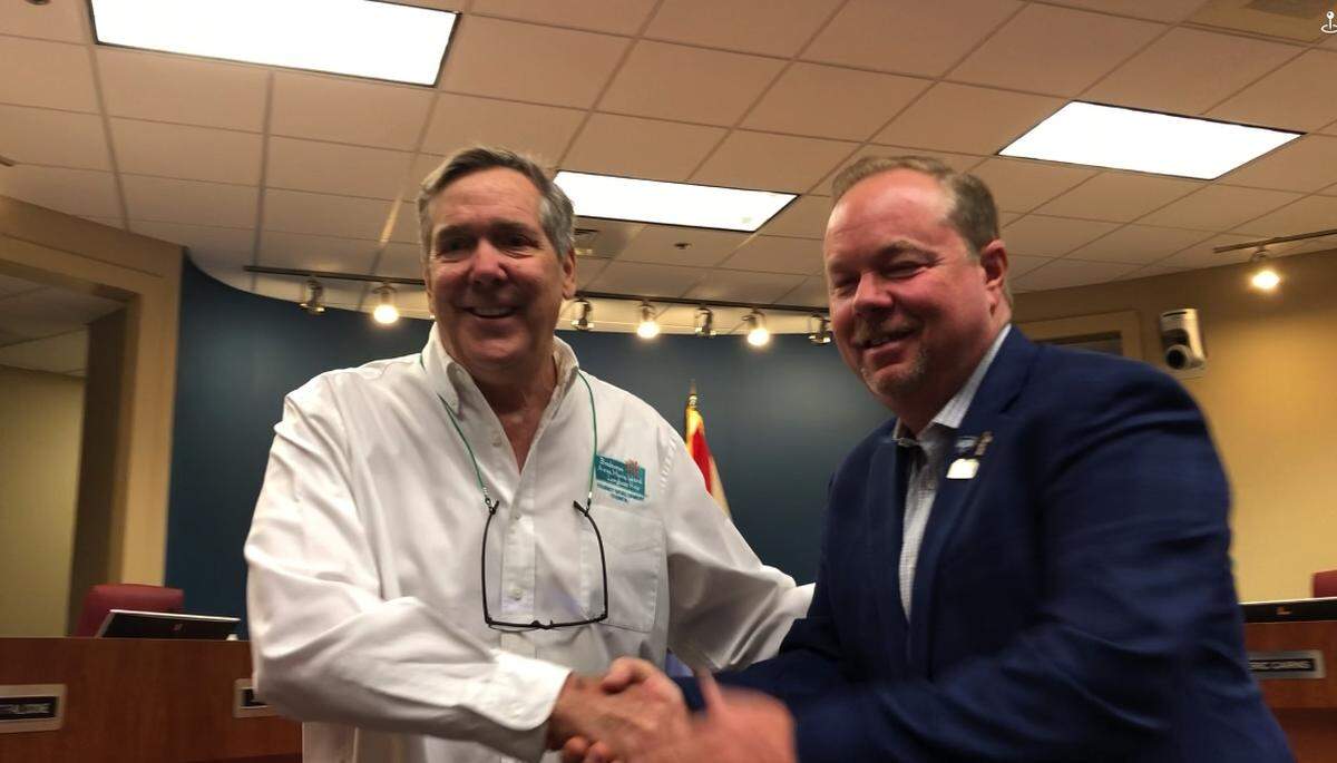 06/21/2021--Mayor Gene Brown on Monday congratulates Ed Chiles for his 25 years of service on the Manatee County Tourist Development Council.