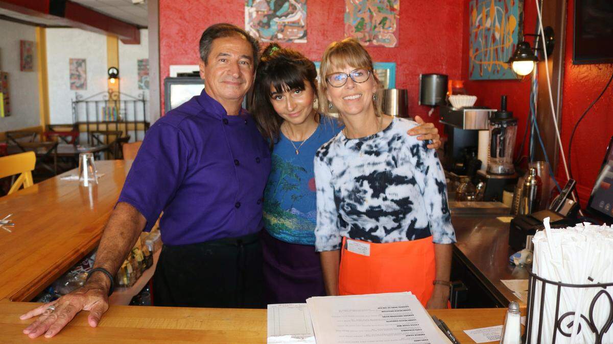 Tahini Beach Cafe, which opened this week at 103 Gulf Drive North, Bradenton Beach, is all about Mediterranean and Middle Eastern cuisine served in a relaxed, seaside setting. Shown March 8, 2022, from left are chef Emad Al-Masri, Jasmine Al-Masri, and Betsy Hughes.