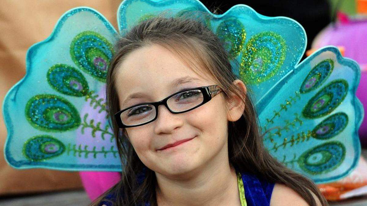 FILE: Charlotte Lackey, 8, is a peacock at the Manatee County Fairgrounds in Palmetto at the Crime Stoppers 12th annual Halloween Safe Kids Night. 
 TIFFANY TOMPKINS-CONDIE/Bradenton Herald