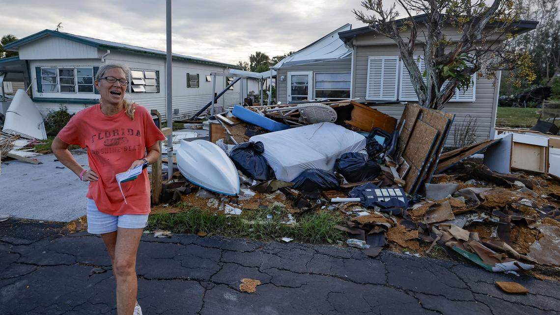 Cindy Herman reacts as she inspects the damage of her home caused by Hurricane Milton and Hurricane Helene two weeks before at Venice Bay Adult Park in Venice, Florida on Thursday, Oct. 10, 2024.
