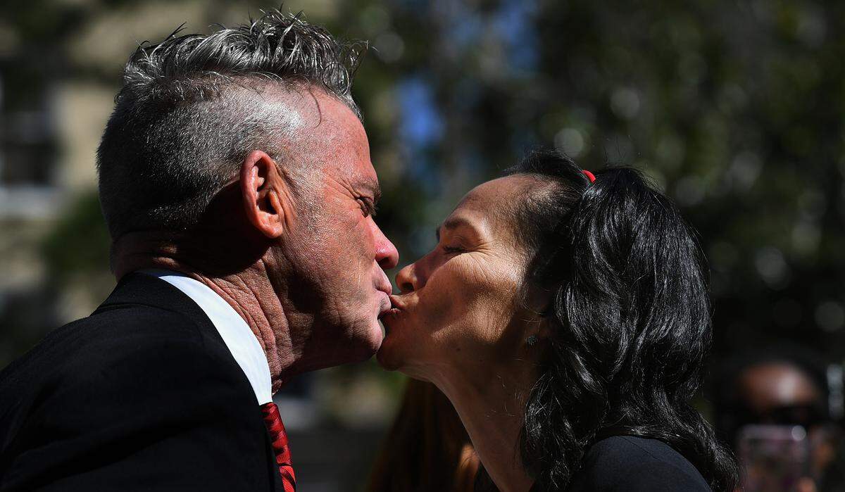 Allen and Gabriela Jones smooch after couples made their relationships official during a group wedding ceremony at the Manatee County Historic courthouse’s gazebo on Feb. 14, 2022. Clerk of Court’s Angel Colonneso officiated over the ceremony where couples recited their vows.