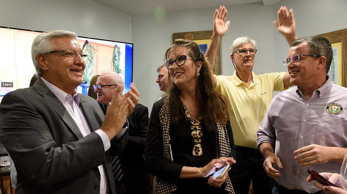 11/02/21—Ernie Withers, Cynthia Saunders, David Voss and Charlie Kennedy react after the election results come in, showing that the school district referendum extending a 1-mill tax had passed while gathering at the Anna Maria Oyster Bar Landside Tuesday night.