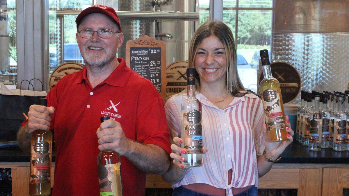 Steve Milligan opened Loaded Cannon Distillery July 19 in Lakewood Ranch. He is shown with Michelle Russell.