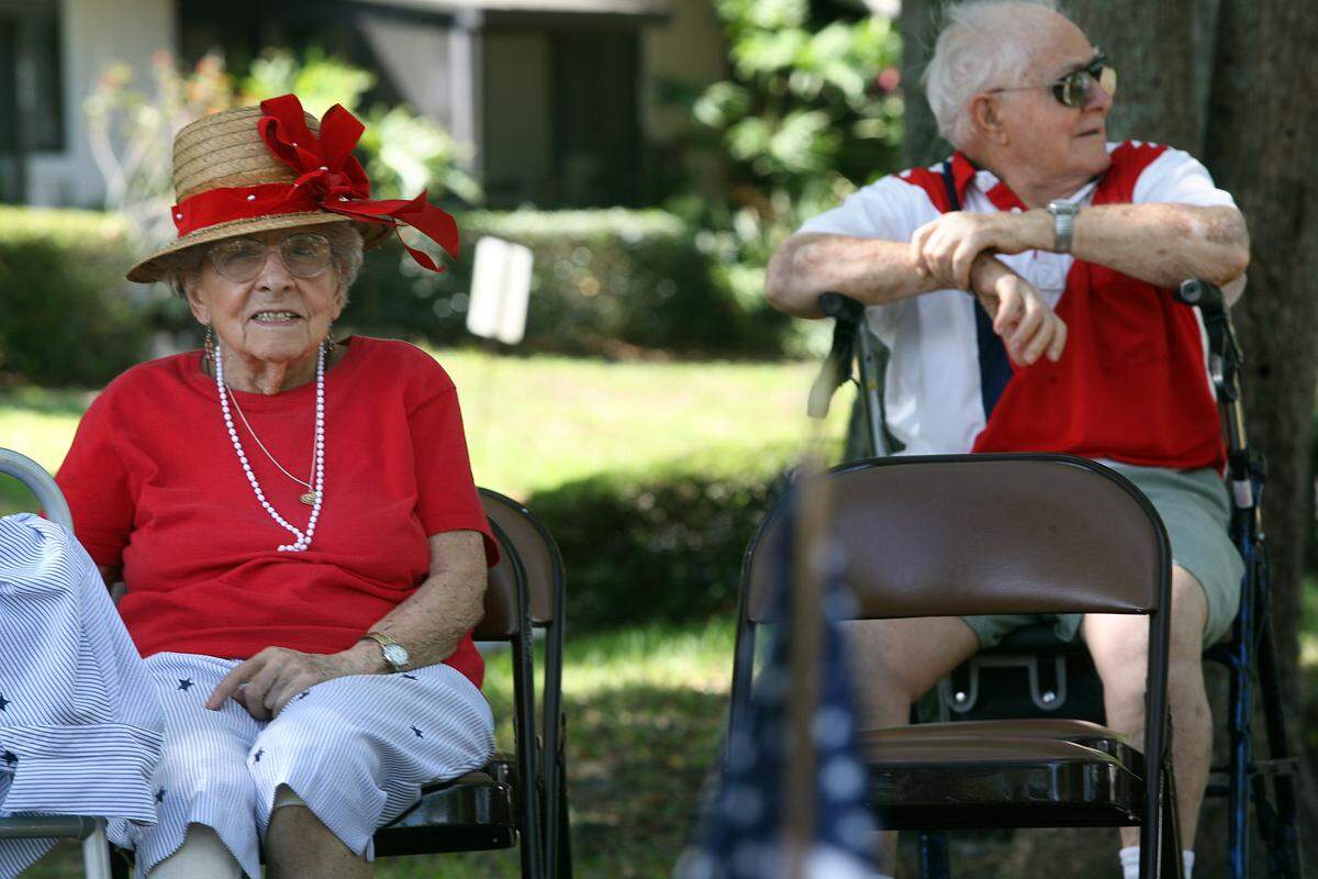 Woodlands Village resident Nancy Bender wears a hat she made specially for during the 2011 Memorial Day observance at the facility.