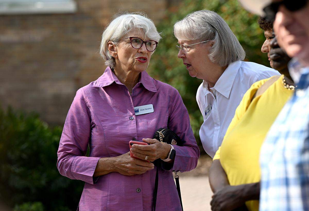 Alice Newlon and Ruth Harenchar of the League of Women Voters of Manatee County during a press conference at the Manatee County Historic Courthouse on Friday. The press conference was organized by the Manatee County Democratic Party to protest the recently passed immigration bill SB 1718.