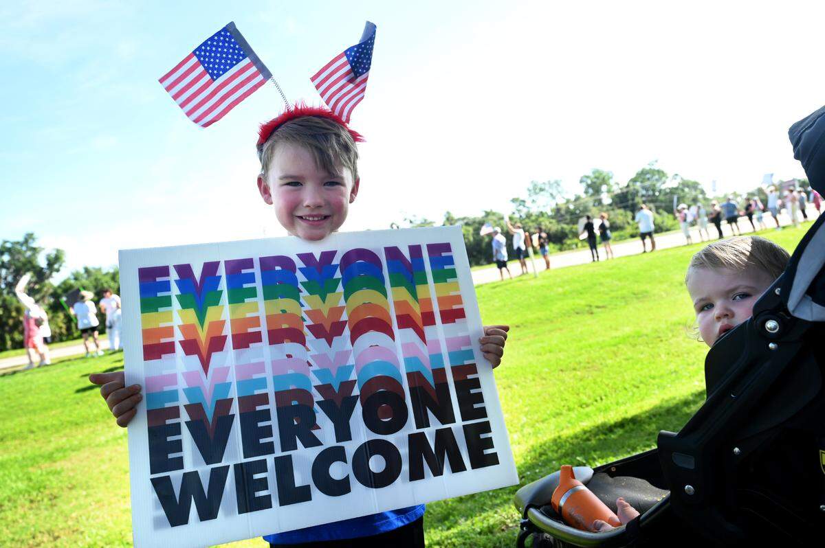 A young boy and his little sister joined hundreds attending the No Kings protest organized by Indivisible Manatee near the University Town Center along University Parkway in Sarasota on June 14, 2025.