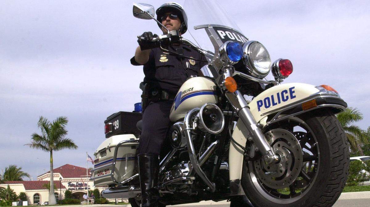 Bradenton Police Sgt. Chris Didas, on one of two new Harley-Davidson Road King Police Motorcycles, that have recently joined the departments fleet. Photo Jefferies 2-12-02