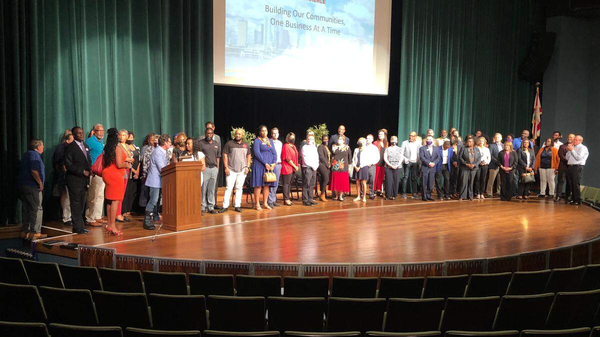 10/21/2021--Audience members came on stage at the conclusion of the Elevating CommUnity event Thursday night at State College of Florida, Manatee-Sarasota. The event was a co-production of the Manasota Black Chamber of Commerce and the Lakewood Ranch Business Alliance to support expansion of the Black business community.