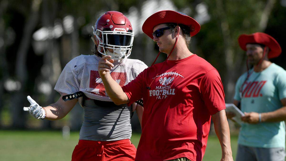 Josh Weirich works with players at Manatee High during practice at on Wednesday, Sept. 21, 2022.