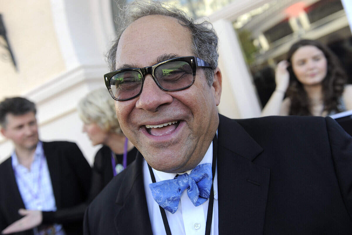 Longtime festival sponsor Mark Famiglio laughs on the red carpet at the Sarasota Opera House on a past opening night of Sarasota Film Festival in 2018.