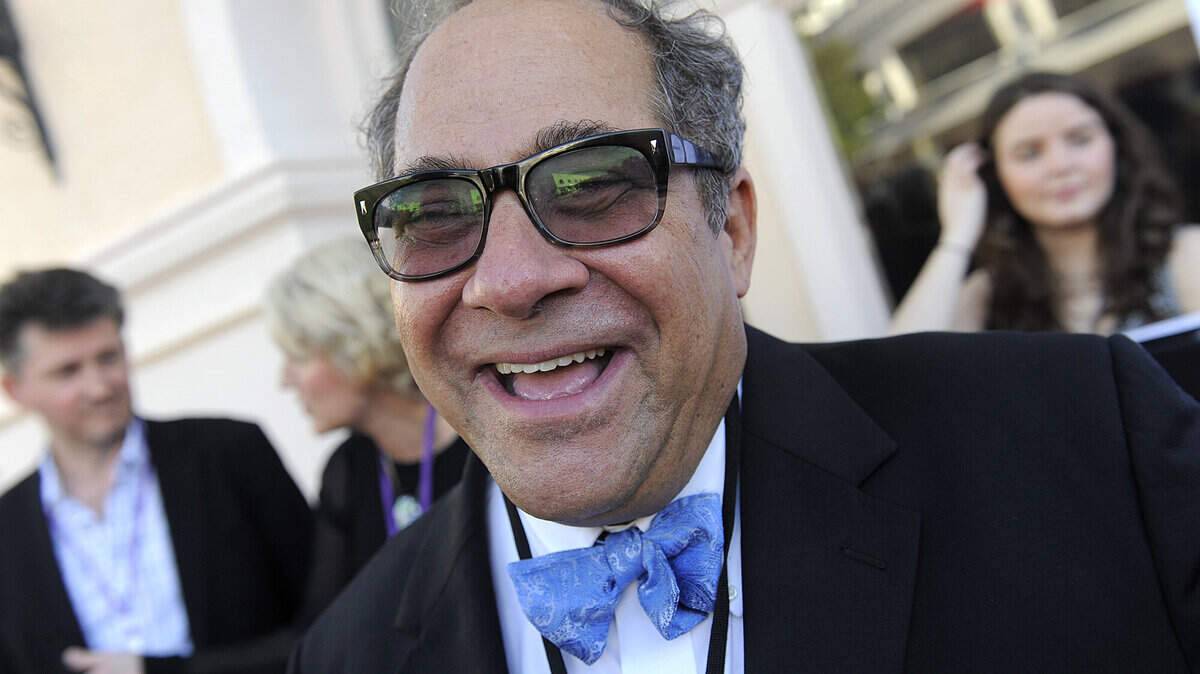 Longtime festival sponsor Mark Famiglio laughs on the red carpet at the Sarasota Opera House on a past opening night of Sarasota Film Festival.