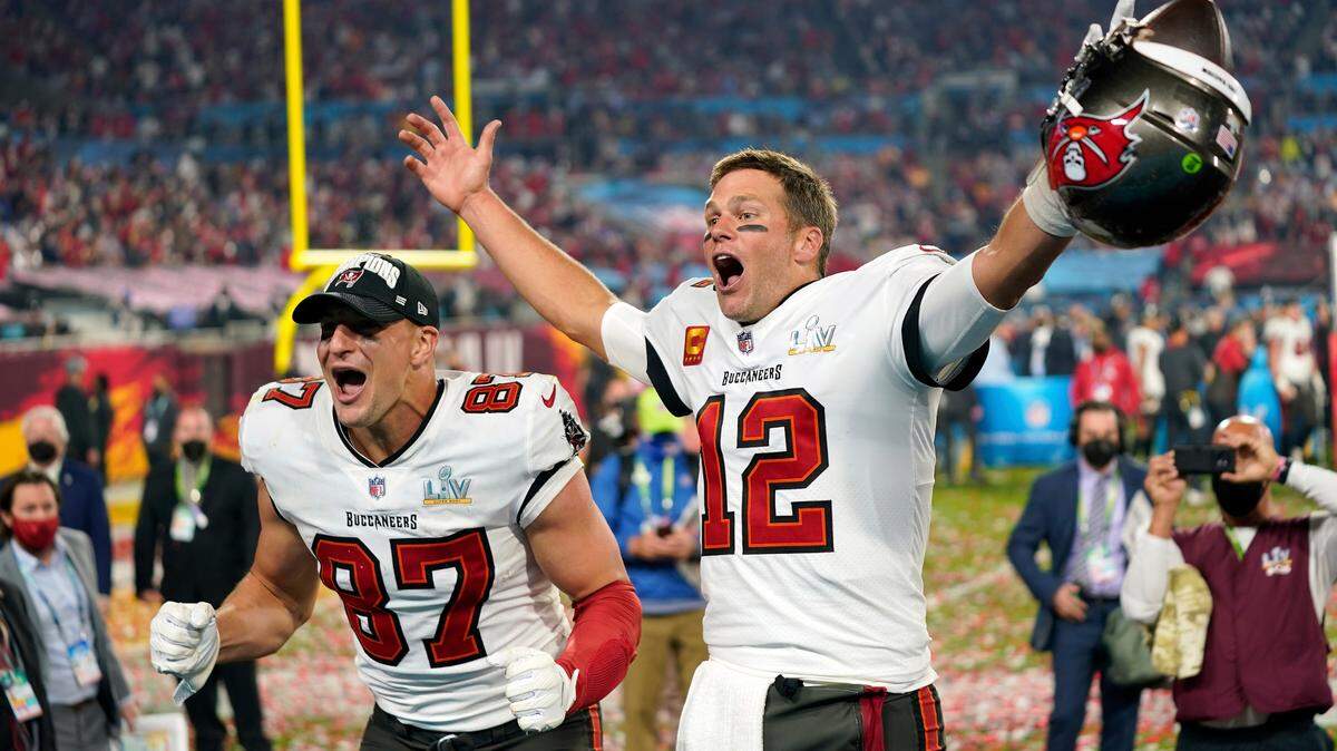 Tampa Bay Buccaneers tight end Rob Gronkowski, left, and quarterback Tom Brady (12) celebrate after the NFL Super Bowl 55 football game against the Kansas City Chiefs in Tampa, Fla., Feb. 7, 2021.