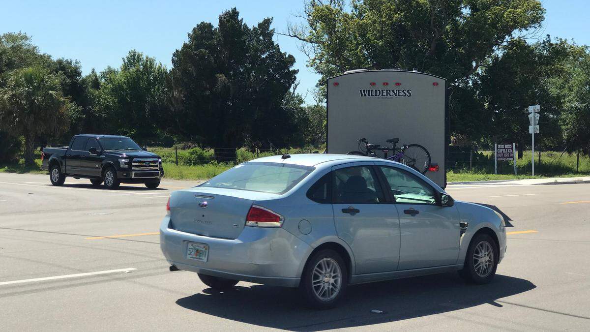 Absent a fully functioning traffic signal at the intersection of County Road 675 and U.S. 301, drivers look for a gap in traffic and try to judge the speed of oncoming vehicles before making a turn.
