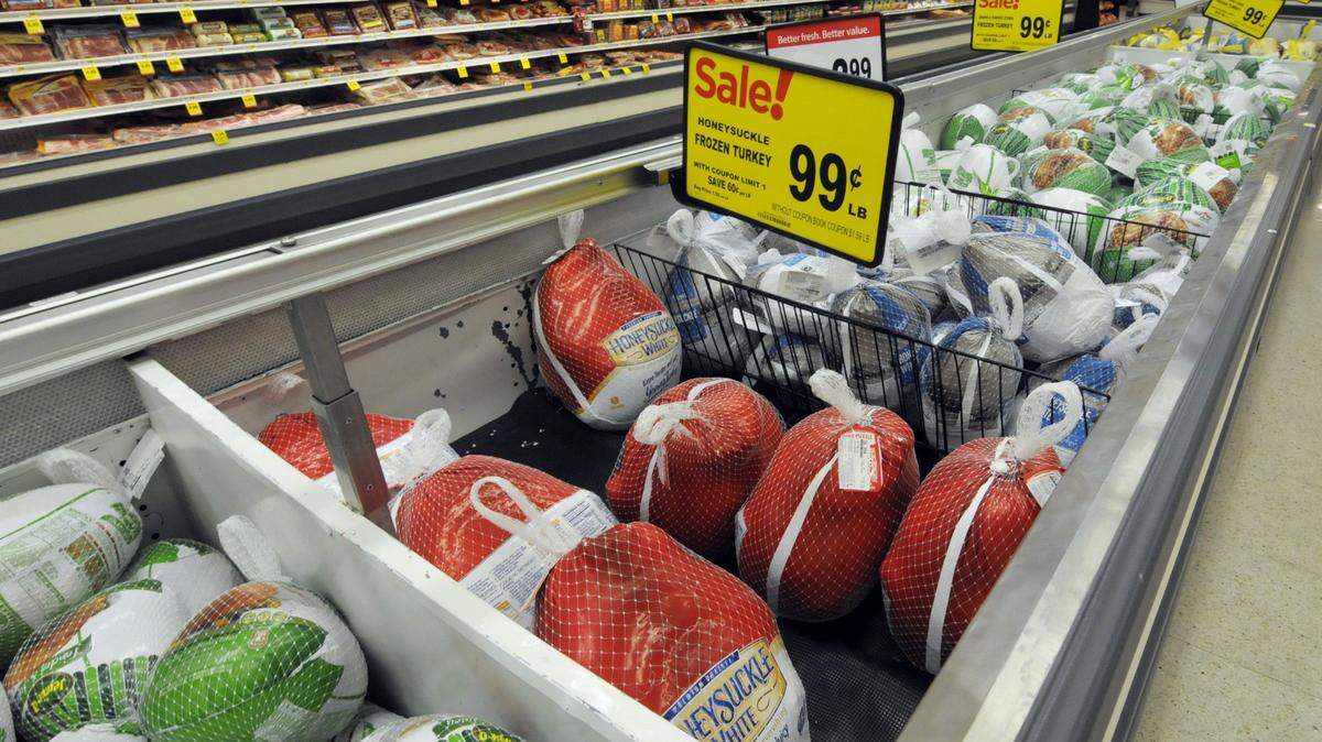 In this Nov. 5, 2015, photo, Thanksgiving turkeys are shown at a Cub Foods store in Bloomington, Minn. Richard Volpe, a retail food price economist formerly with the U.S. Department of Agriculture, said one of the most effective things supermarkets can do to lure holiday shoppers is to advertise cheap turkeys whose prices tend to be lowest around the holidays when demand is highest. (AP Photo/Jim Mone)