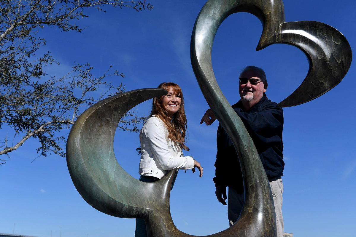 Award winning actress and artist Jane Seymour unveiled her sculpture, ‘Open Hearts’ at the Bradenton Riverwalk Friday morning, and poses afterwards with Bradenton Mayor Wayne Poston.