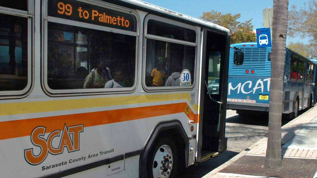 Sarasota County Area Transit and Manatee County Area Transit busses share a stop in this 2010 file photograph. 
 File Photo-GRANT JEFFERIES/Bradenton Herald