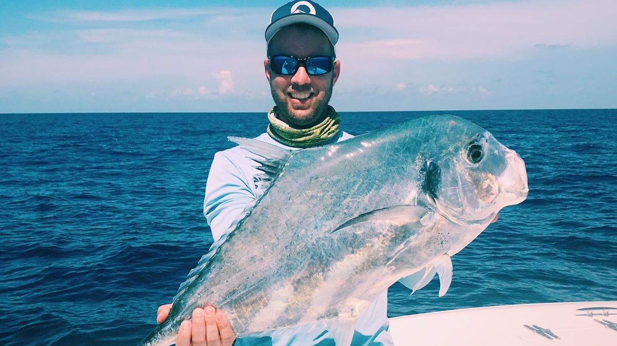 Jon Chapman shows off an African pompano caught in 155 feet of water in the Gulf of Mexico.