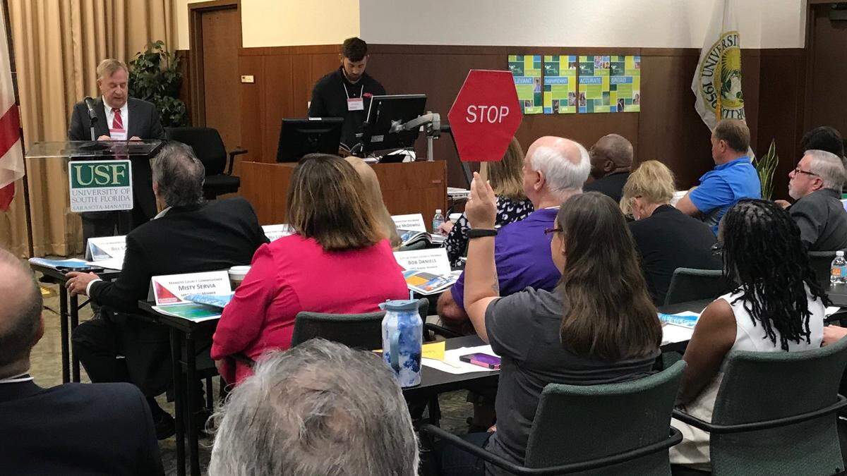 With more than 20 speakers addressing the long-range traffic planning forum for the Bradenton-Sarasota area at USF Sarasota-Manatee on Monday, time was limited. Speakers got a red stop sign when it was time for them to leave the dais.