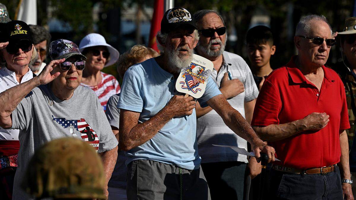 Veterans and family members stood for the National Anthem during the Memorial Day Service presented by the Manatee County Veterans Council at the Donald L. Courtney Veterans Park in Bradenton on Monday, May 27, 2024.