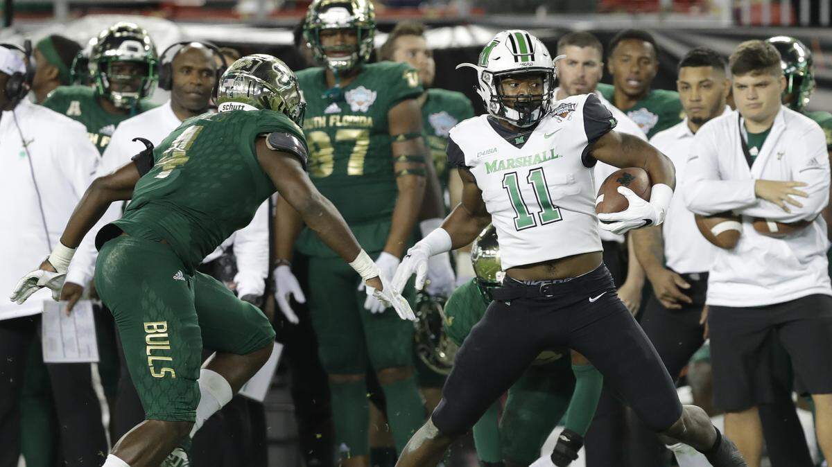 Former Manatee High standout Greg Reaves (4) turned in a dominant defensive effort for USF during Thursday night’s Gasparilla Bowl loss to Marshall.