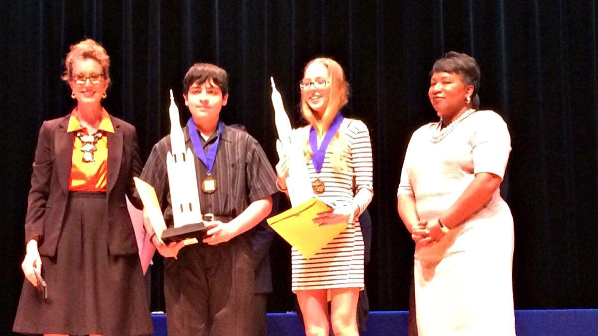 Cynthia Saunders, deputy superintendent of instruction, and Diana Greene, Manatee County School District Superintendent, post with the best in show winners from the district's science and engineering fair. PHOTO PROVIDED