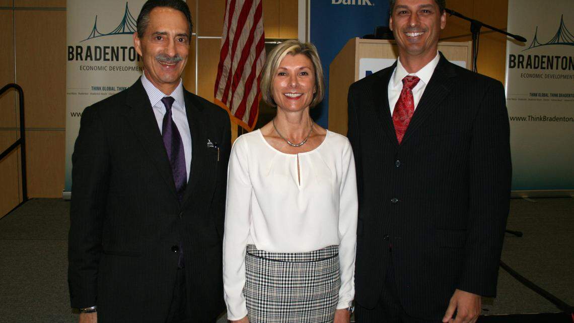 Dr. Henry Fishkind, left, presented an economic forecast for Manatee County on Thursday morning at Manatee Technical College. The event was hosted by the Bradenton Area Economic Development Corporation. The corporation's CEO, Sharon Hillstrom, center, poses with Fishkind and Mike Moschella, the corporation's chair, after the event. PROVIDED PHOTO