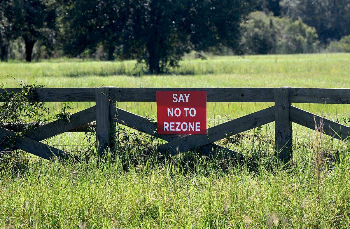 A sign on a fence across from one of the entrances to TerraNova Equestrian Center on Clay Gully Road in Myakka on Sept. 24, 2025.