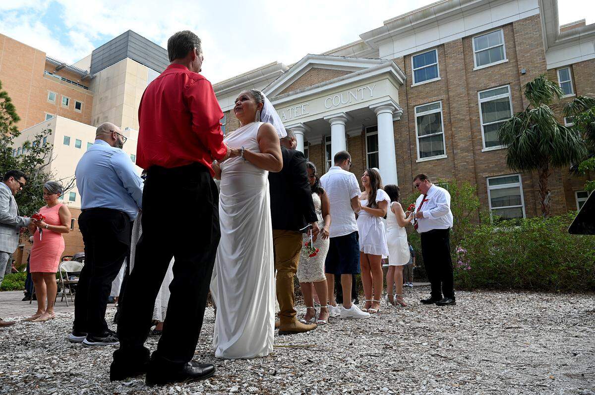 Fourteen couples get married during the Fifth Annual Valentine’s Day Group Wedding.