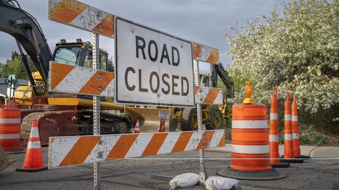 road closed - sign and barrier on a residential street for construction