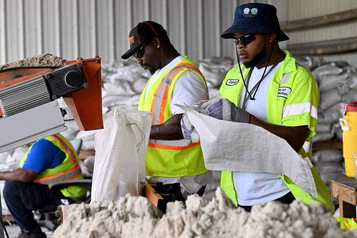 City of Bradenton employees fill sandbags at the Public Works Annex, 1411 Ninth St. W.