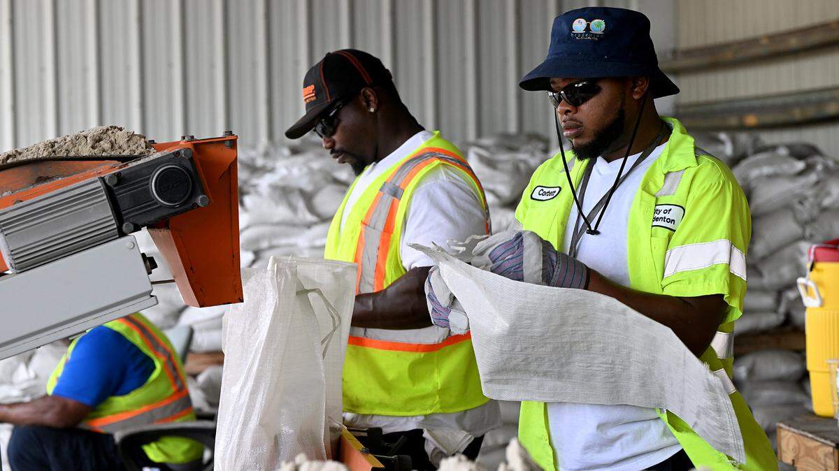 City of Bradenton employees fill sandbags at the Public Works Annex, 1411 Ninth St. W. where city residents can pick up filled bags ahead of Helene.