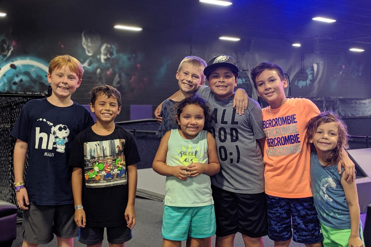 Ezra DeJesus (third from right) celebrates his ninth birthday with friends and family at DEFY Bradenton, a new extreme air sports park in Manatee County.